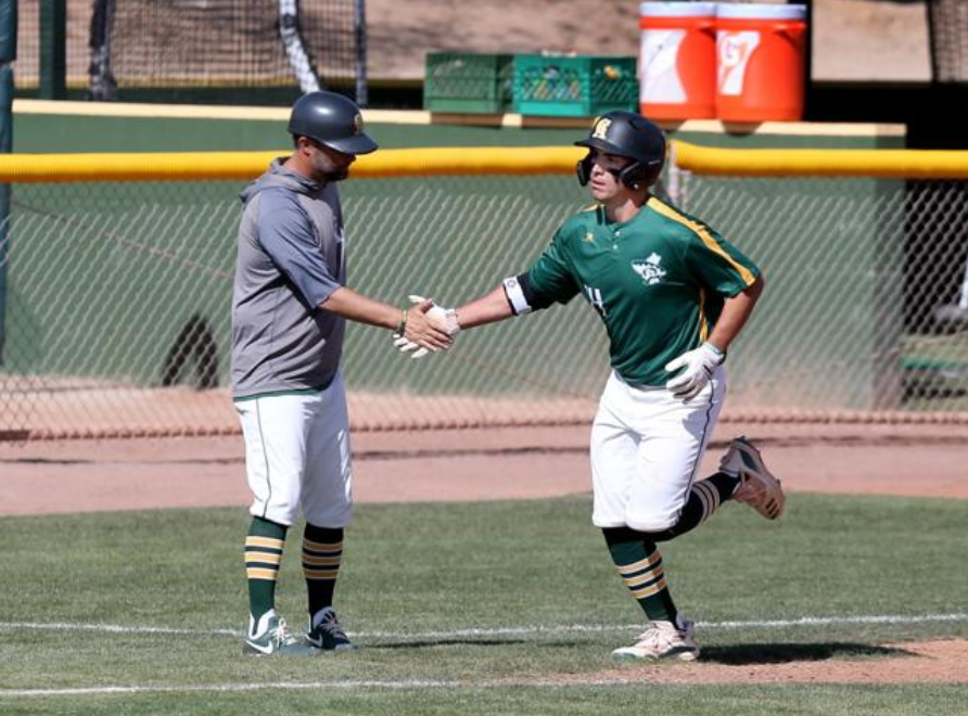Head Coach Anthony Gilich congratulates Blake Avila on a round tripper. Gilich was named 2022 ACCAC Coach of the Year Monday afternoon.