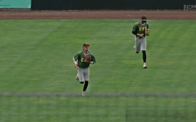 Jaylin Rae heads to the dugout for the top of the tenth after making the final out catch in the bottom of the ninth.