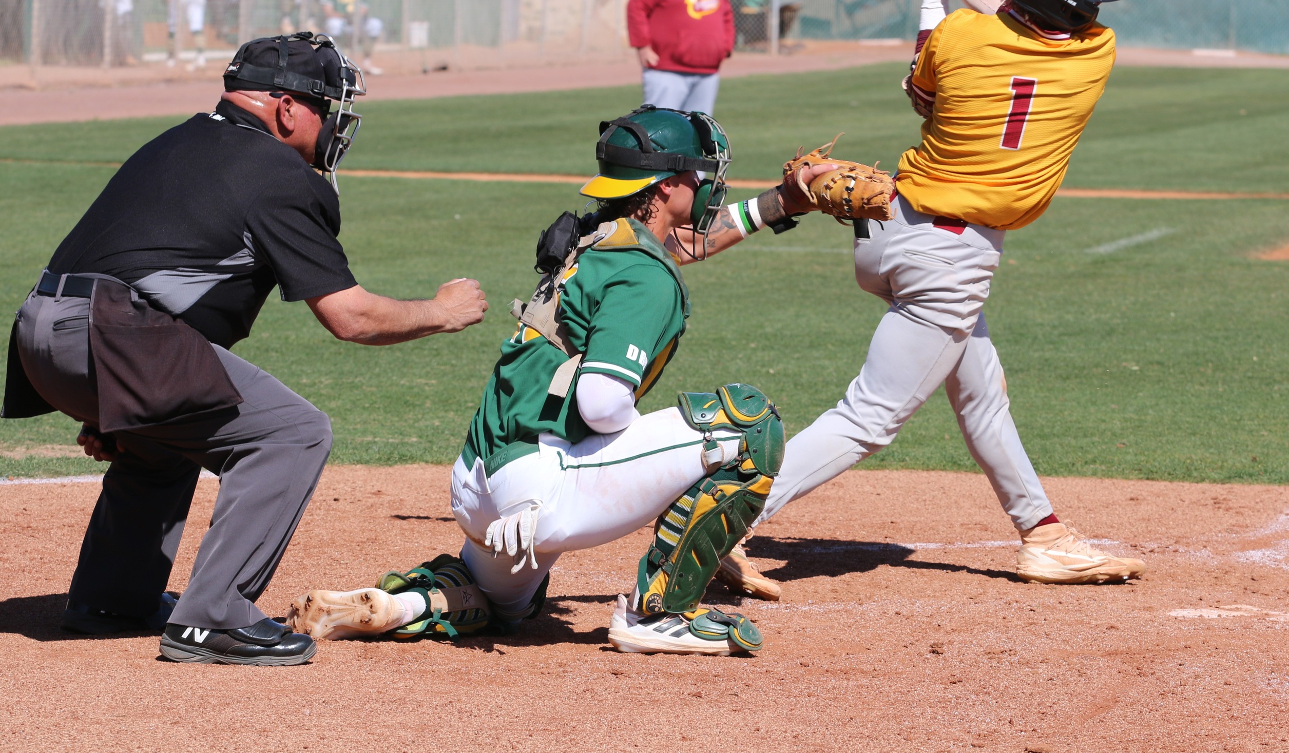 Tug gets a sit-down sir here with catcher Lou Albrecht against Westerm Arizona last week. Wilkinson fanned 11 and won his fourth game Saturday against Eastern Arizona